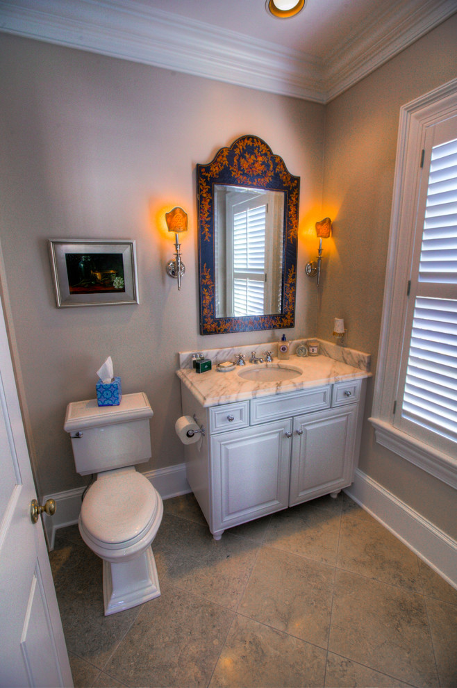 Mid-sized transitional master gray tile, white tile and stone slab marble floor freestanding bathtub photo in Charlotte with shaker cabinets, white cabinets, a two-piece toilet, white walls, an undermount sink and marble countertops