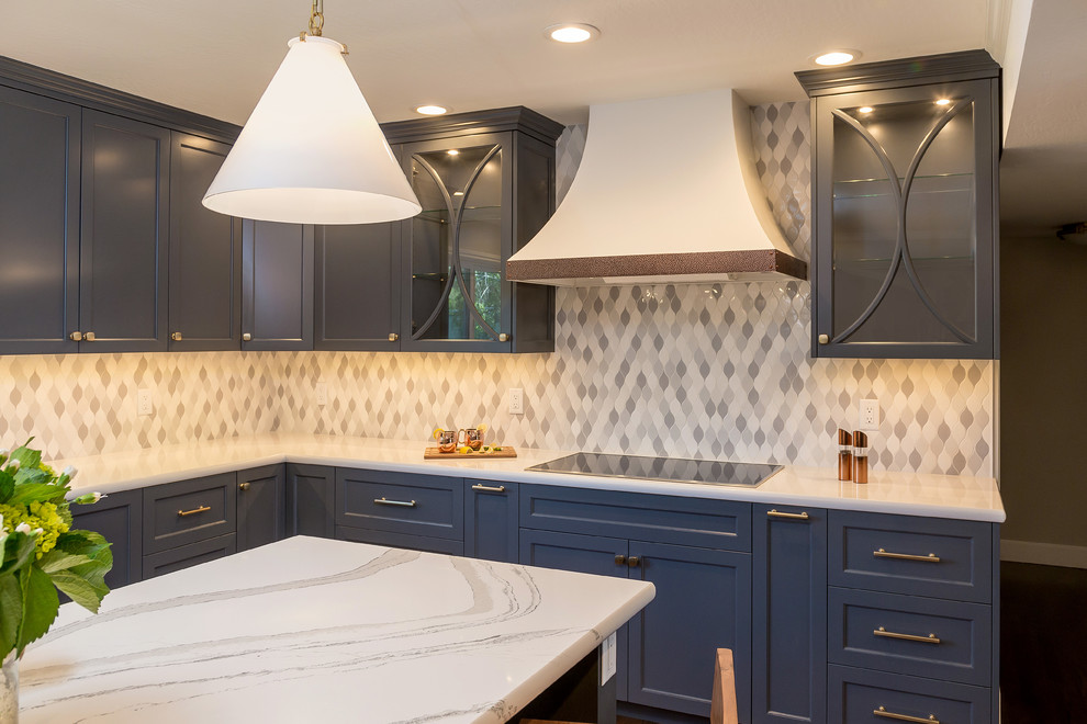 Inspiration for a large transitional kitchen in San Francisco with an undermount sink, glass-front cabinets, blue cabinets, quartz benchtops, grey splashback, ceramic splashback, stainless steel appliances, dark hardwood floors, with island and brown floor.