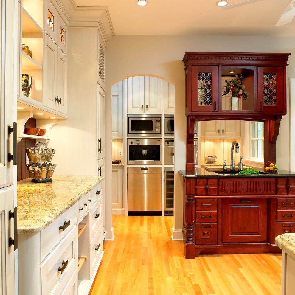 This is an example of a traditional kitchen in Vancouver with stainless steel appliances.
