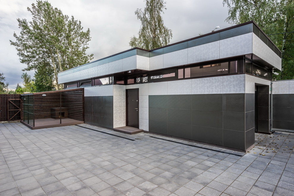 Photo of a contemporary detached garage in Saint Petersburg.
