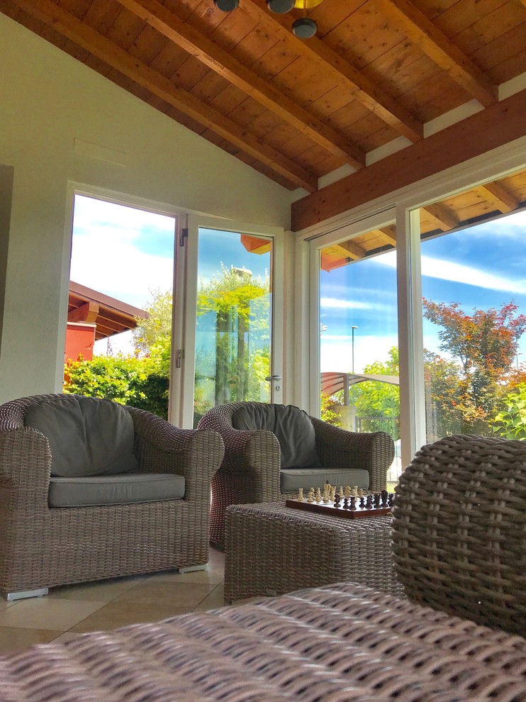 This is an example of a contemporary sunroom in Other.