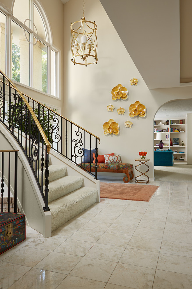 Design ideas for a large eclectic foyer in Minneapolis with beige walls and marble floors.