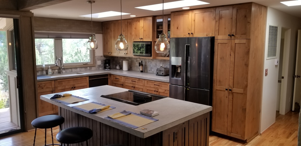 Photo of a country kitchen in Phoenix with shaker cabinets.