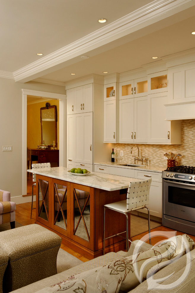 Eat-in kitchen - small transitional single-wall light wood floor eat-in kitchen idea in Chicago with an undermount sink, recessed-panel cabinets, white cabinets, marble countertops, multicolored backsplash, stone tile backsplash, paneled appliances and an island