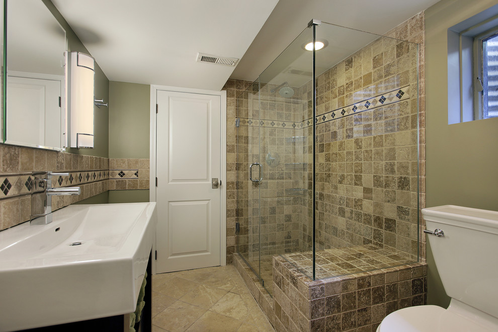 Photo of a large traditional master bathroom in Raleigh with an integrated sink, open cabinets, medium wood cabinets, marble benchtops, a drop-in tub, an open shower, a two-piece toilet, brown tile, stone tile, white walls and travertine floors.