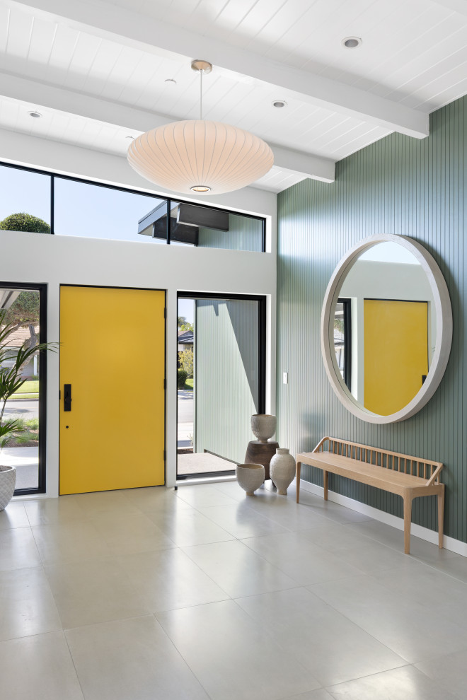 Design ideas for a midcentury foyer in Orange County with green walls, a single front door, a yellow front door, grey floors, exposed beams, a timber clad ceiling and a vaulted ceiling.
