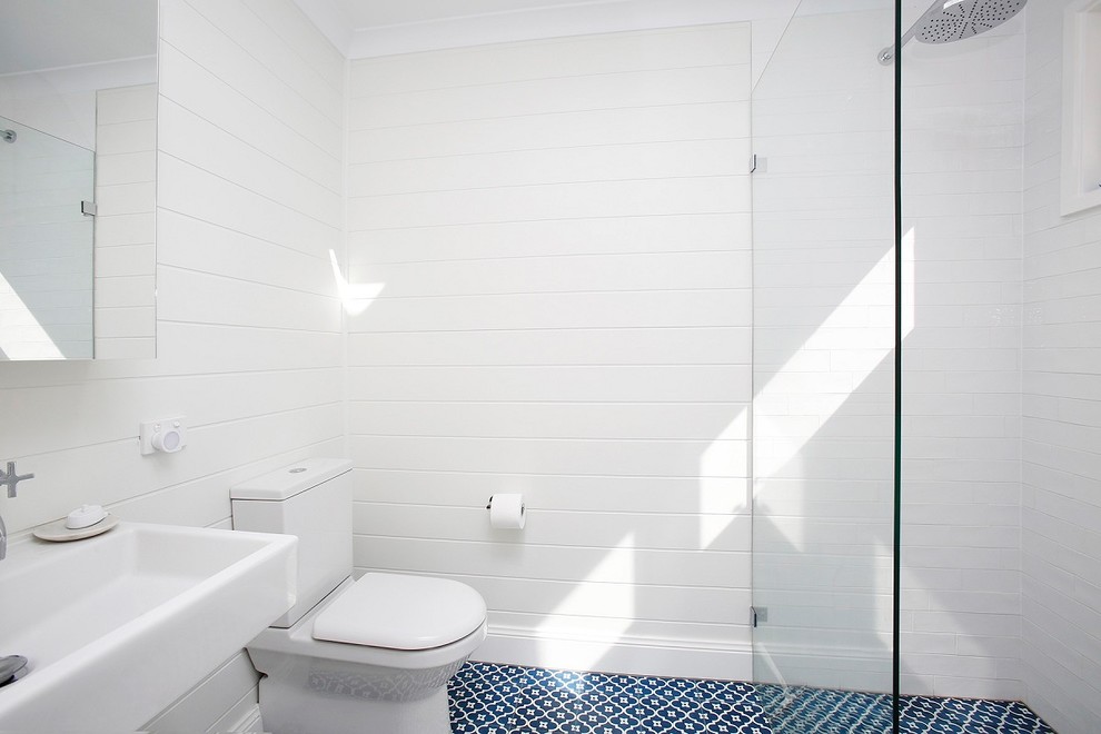 Photo of a small country master bathroom in Other with an open shower, white tile, subway tile, white walls, a trough sink, blue floor, an open shower and white benchtops.