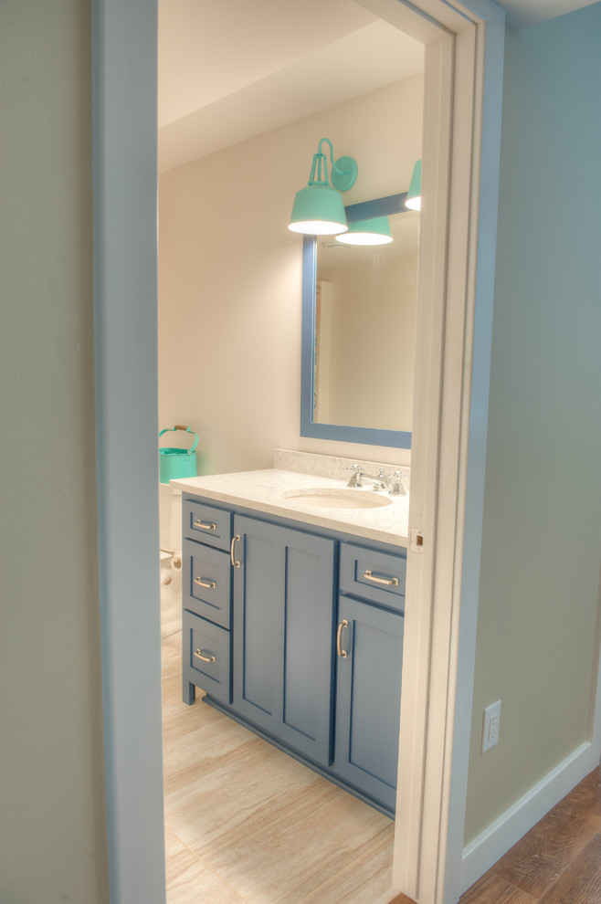 Inspiration for a mid-sized contemporary bathroom in Other with blue cabinets, an undermount sink, quartzite benchtops, recessed-panel cabinets and ceramic floors.