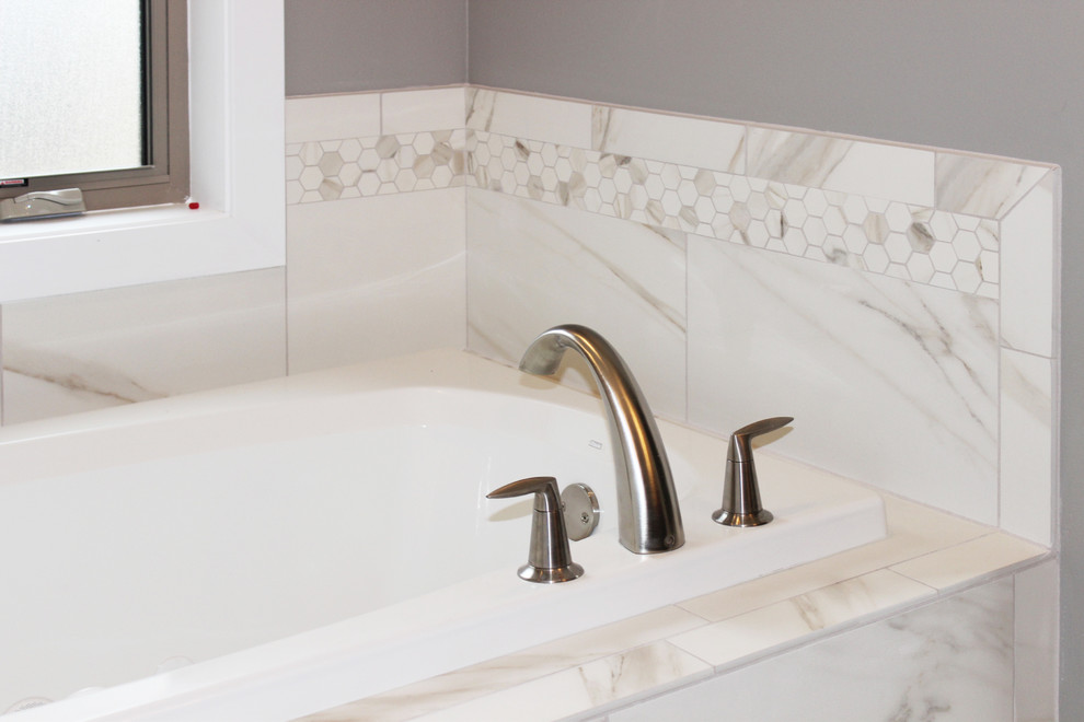 Mid-sized transitional master white tile and porcelain tile marble floor and white floor alcove bathtub photo in Cedar Rapids with gray walls