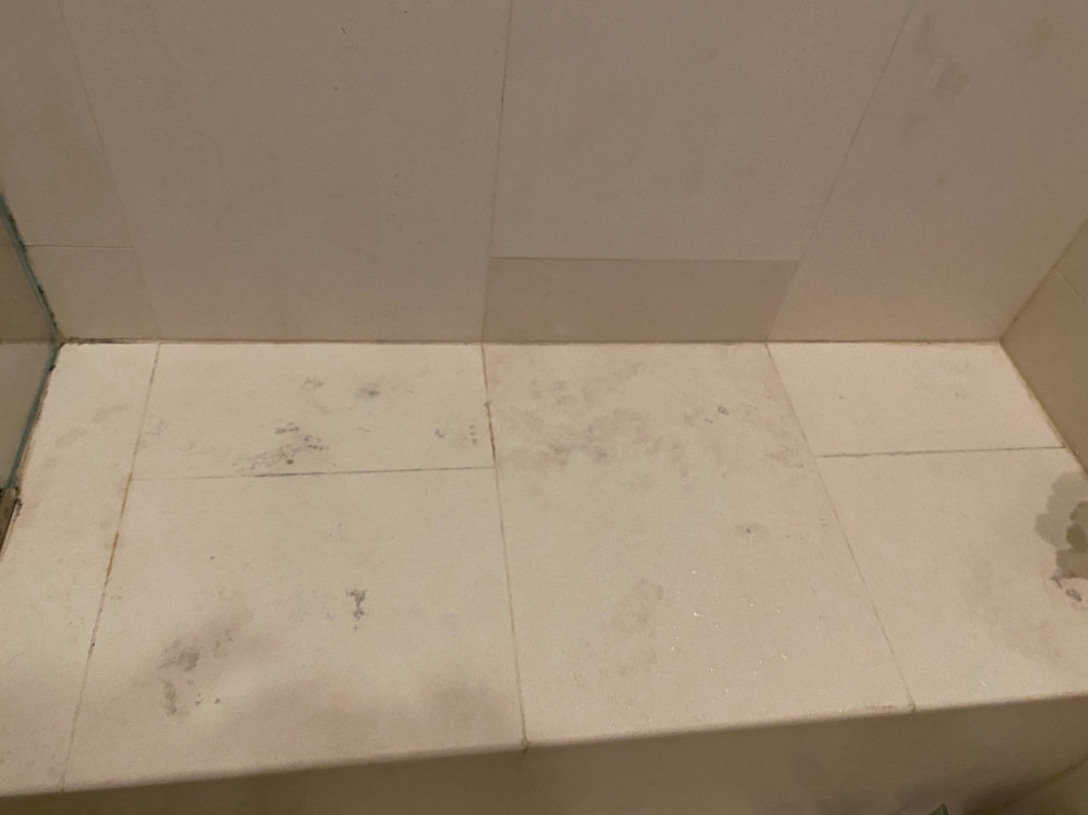 How to clean dark spots / mold from limestone in shower