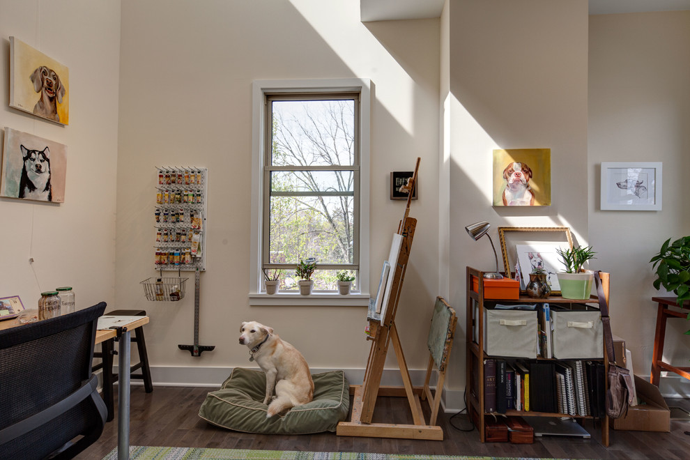 Inspiration for a mid-sized transitional home studio in Other with beige walls, medium hardwood floors, no fireplace, a freestanding desk and brown floor.
