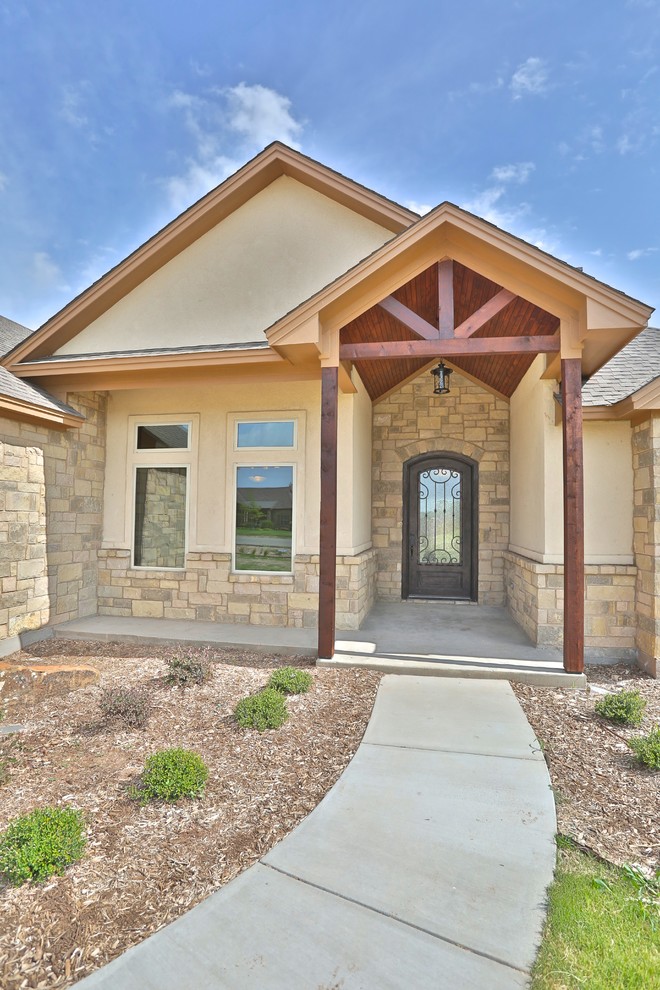 Inspiration for a mid-sized rustic concrete floor front door remodel in Dallas with metallic walls and a metal front door