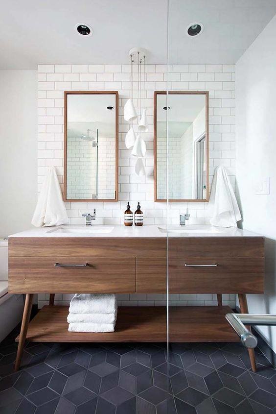 Design ideas for a large midcentury master bathroom in Indianapolis with white tile, white walls, ceramic floors, an undermount sink, solid surface benchtops, flat-panel cabinets, dark wood cabinets, a two-piece toilet, subway tile and grey floor.