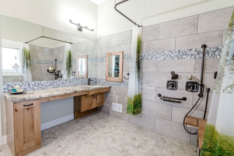 Photo of a mid-sized traditional kids bathroom in Denver with shaker cabinets, medium wood cabinets, an open shower, a one-piece toilet, gray tile, ceramic tile, purple walls, ceramic floors, an undermount sink, granite benchtops, grey floor and a shower curtain.