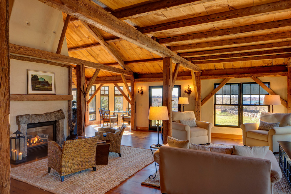 Design ideas for a country open concept living room in Boston with a standard fireplace and a stone fireplace surround.