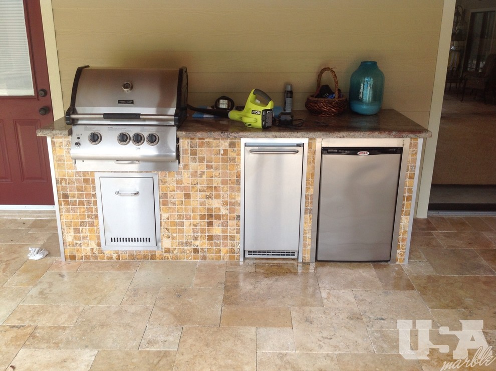 Mountain style travertine floor kitchen photo in Miami with stainless steel appliances