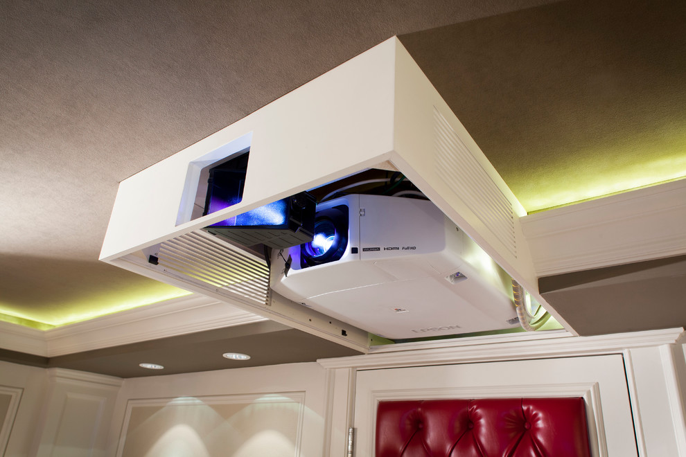Example of a mid-sized transitional enclosed carpeted home design design in New York with beige walls and a projector screen