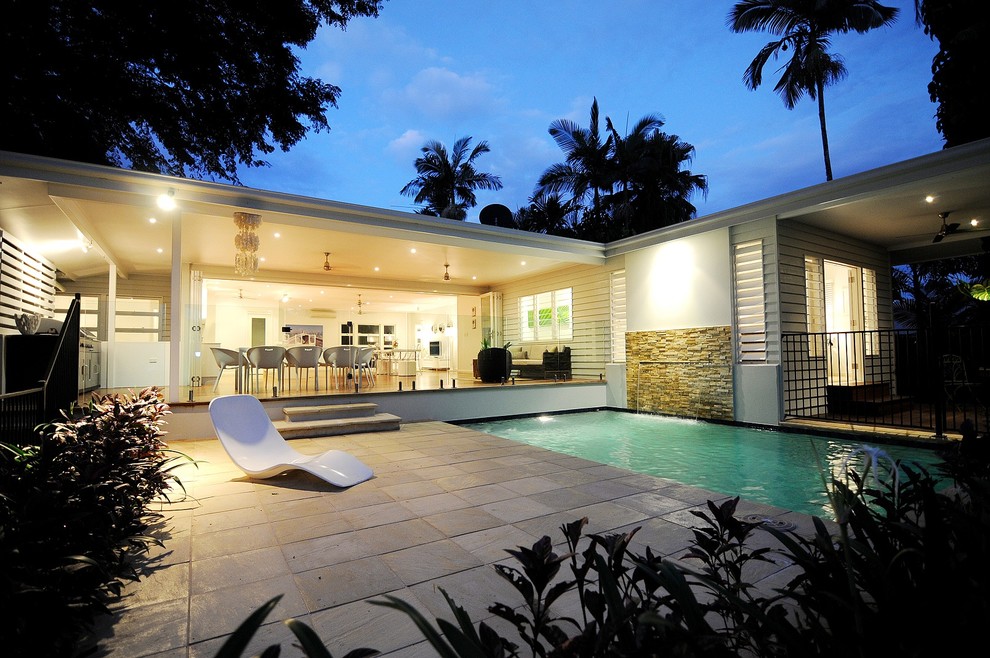 Photo of a large contemporary courtyard pool in Cairns.