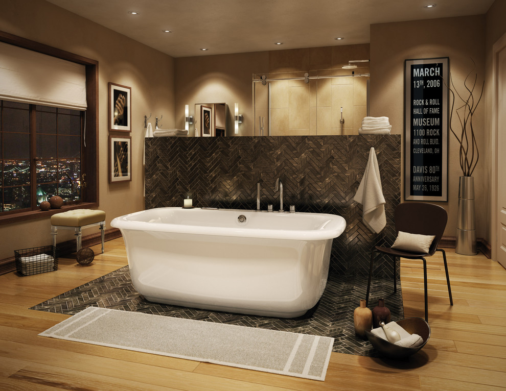Inspiration for a large transitional master bathroom in Montreal with a freestanding tub, a corner shower, gray tile, brown walls and light hardwood floors.