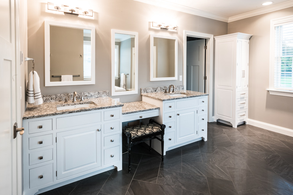 Inspiration for a large transitional master gray tile and ceramic tile ceramic tile freestanding bathtub remodel with beaded inset cabinets, white cabinets, gray walls, a drop-in sink and granite countertops