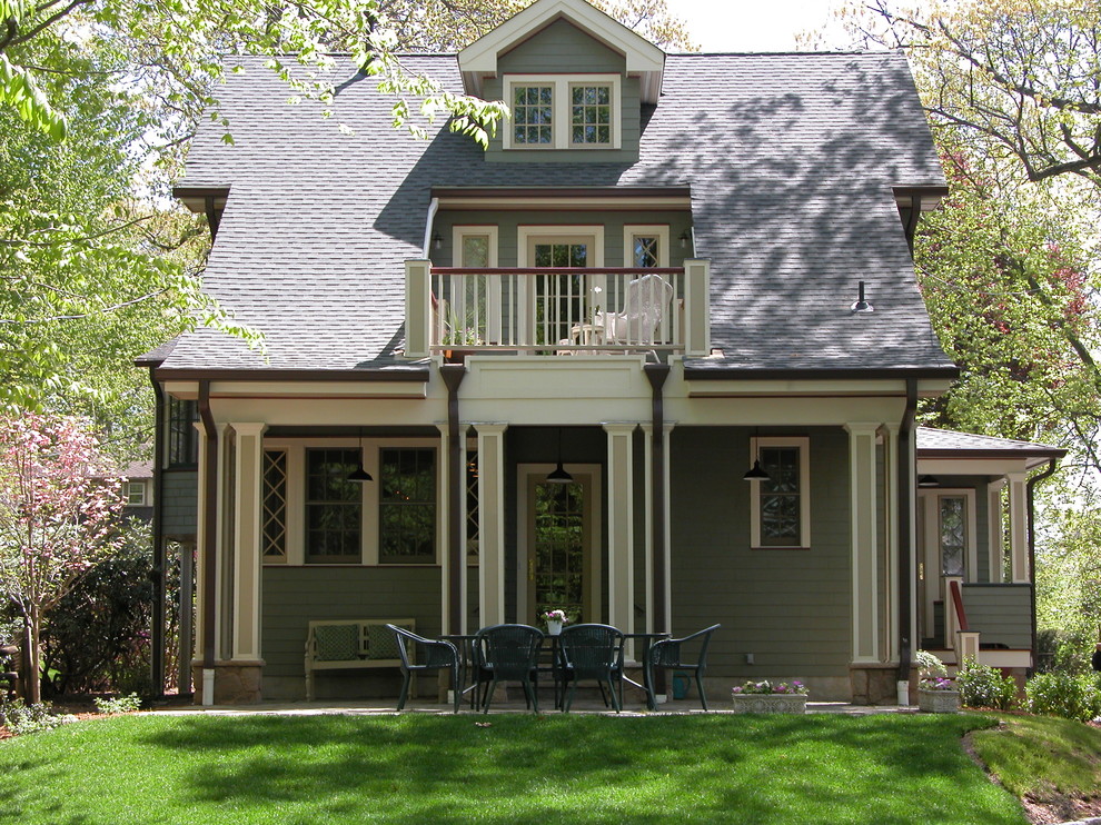 Photo of a traditional two-storey green exterior in New York with wood siding.