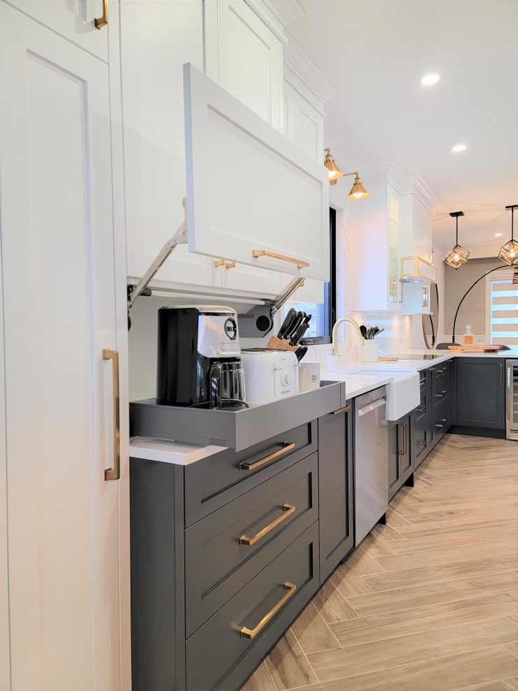 Inspiration for a mid-sized transitional galley porcelain tile and brown floor eat-in kitchen remodel in Montreal with an undermount sink, shaker cabinets, blue cabinets, quartz countertops, white backsplash, quartz backsplash, stainless steel appliances, a peninsula and white countertops