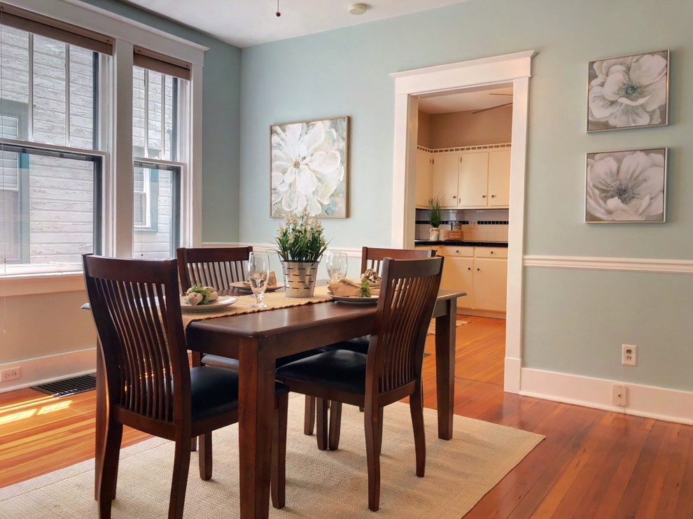 Design ideas for a small eclectic dining room in Philadelphia with blue walls and medium hardwood floors.