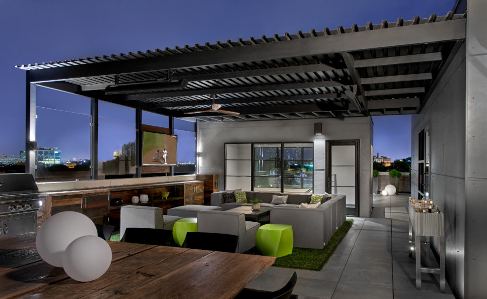 Expansive contemporary rooftop deck in Chicago with an awning.