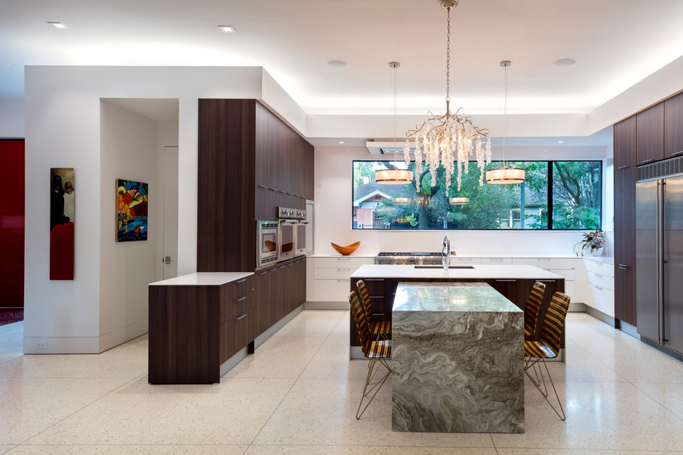 This is an example of a contemporary kitchen in Houston with an undermount sink, flat-panel cabinets, dark wood cabinets, window splashback, stainless steel appliances, multiple islands and beige floor.