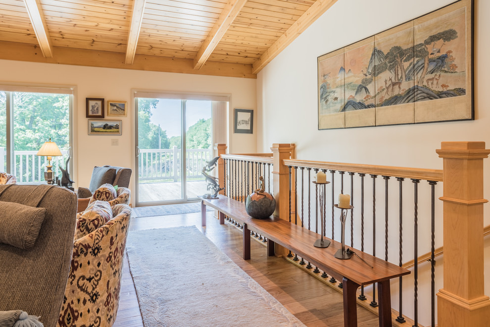 Example of a mid-sized transitional light wood floor and beige floor hallway design with white walls
