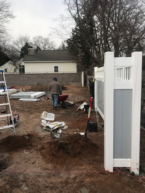 Fence installation after patio and retaining wall