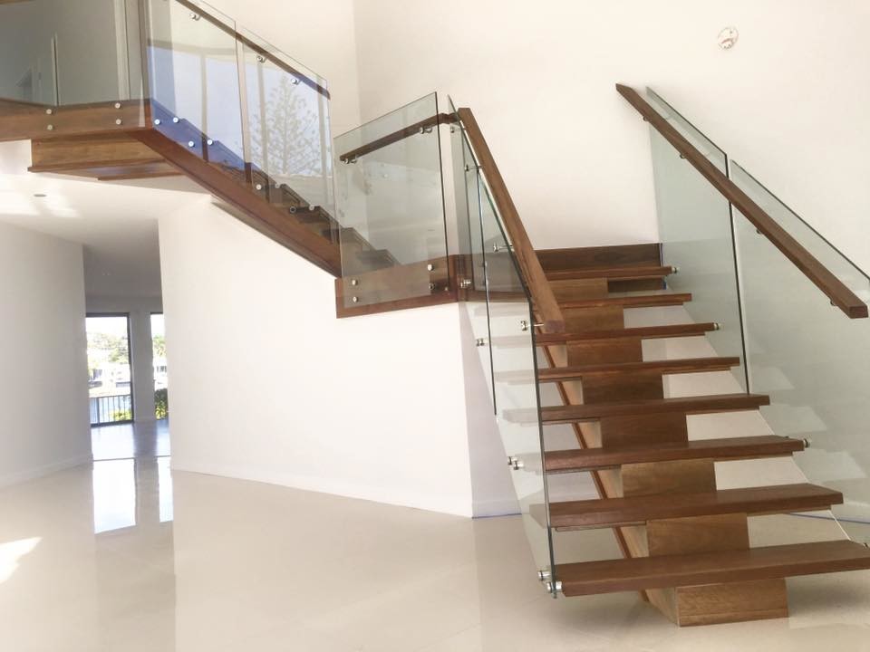 This is an example of a large contemporary wood l-shaped staircase in Gold Coast - Tweed with wood risers.
