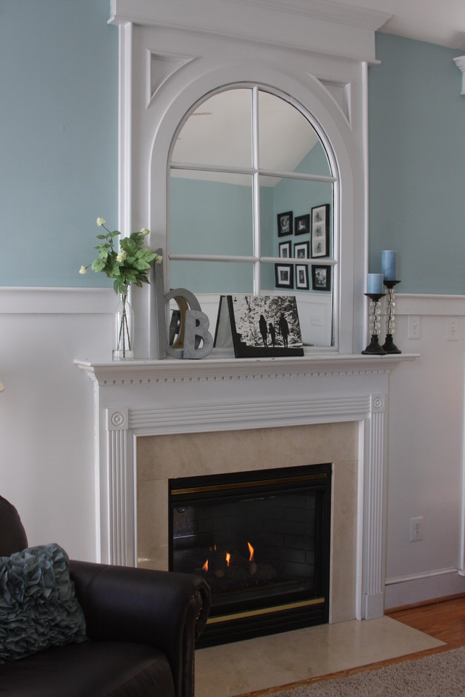Inspiration for a traditional family room in Baltimore with blue walls and a standard fireplace.