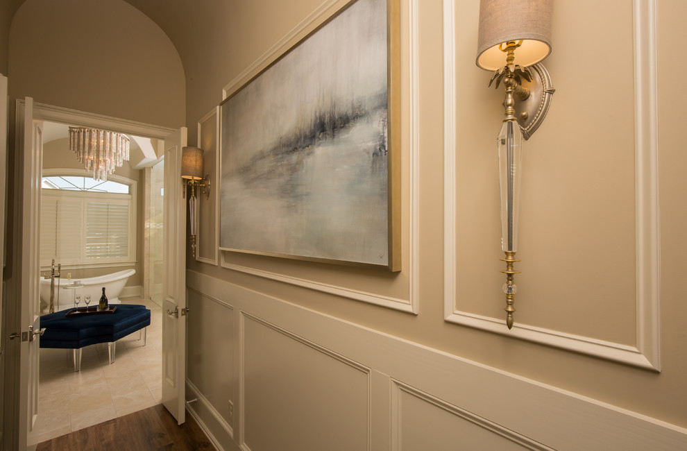 Example of a large transitional ceramic tile and brown floor hallway design with beige walls