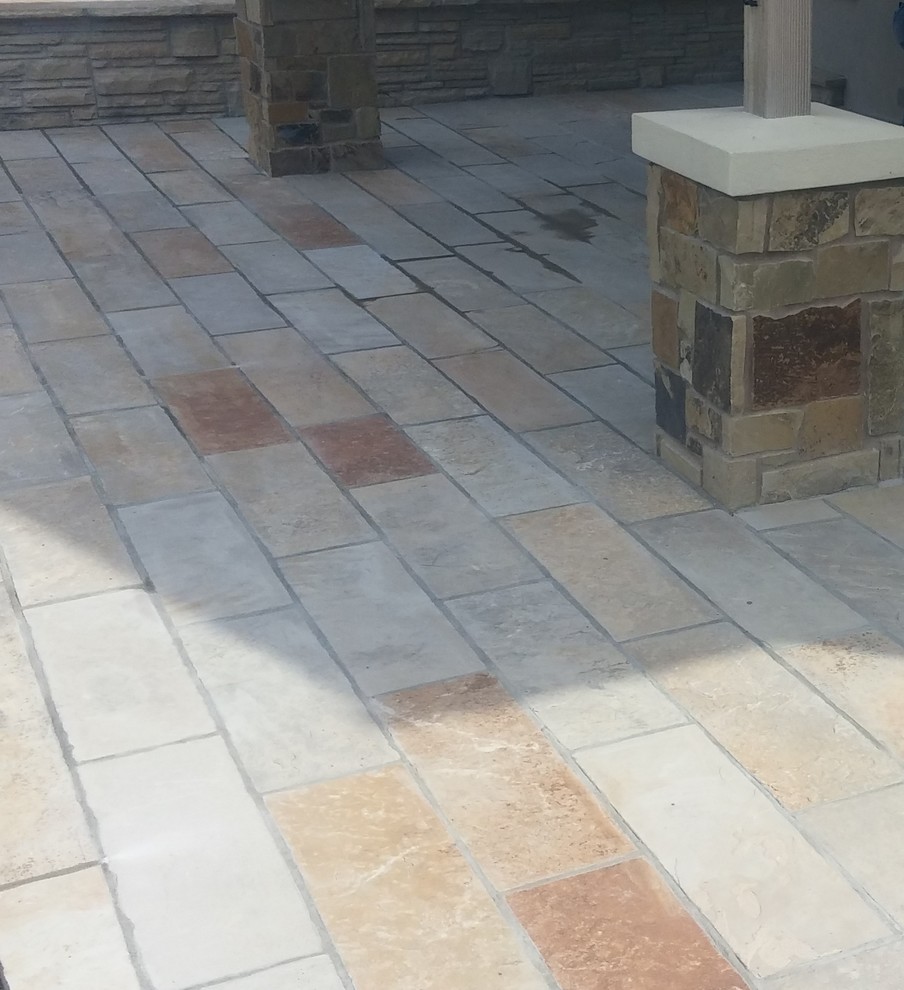 Design ideas for a large full sun backyard stone outdoor basketball/tennis/multi-game court in Denver for summer.