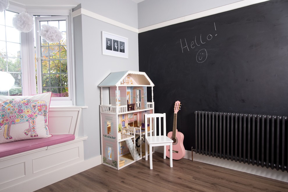 Design ideas for a mid-sized transitional kids' playroom for girls in Surrey.