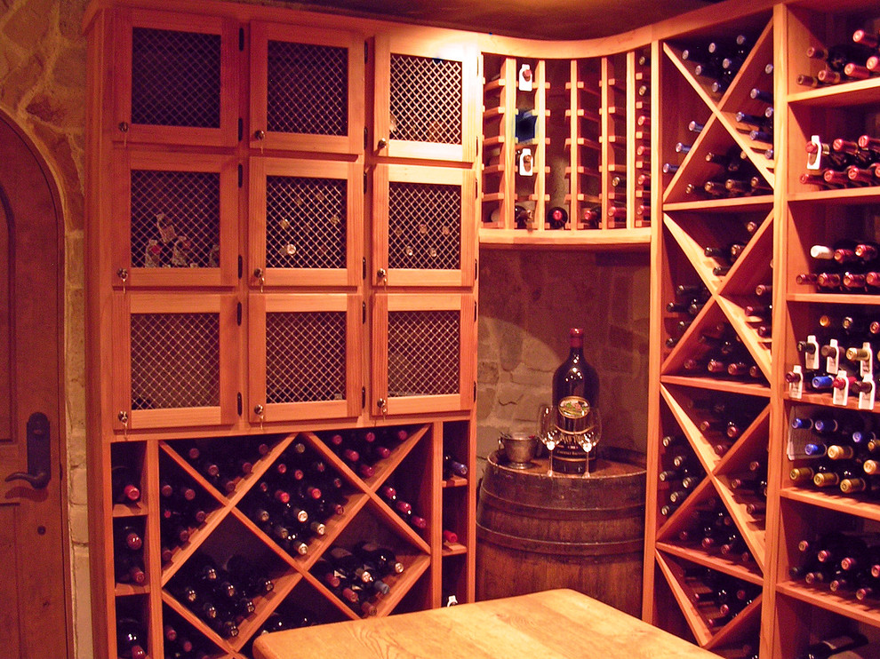 Photo of a mid-sized traditional wine cellar in Sacramento with diamond bins.