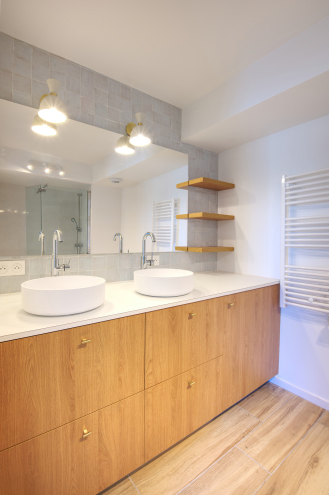 Design ideas for a small beach style 3/4 bathroom in Montpellier with wood-look tile, a drop-in sink, white benchtops, beaded inset cabinets, light wood cabinets, gray tile, terra-cotta tile, white walls, beige floor, a double vanity and a freestanding vanity.