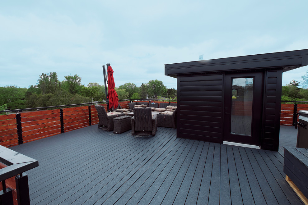 Inspiration for an expansive industrial deck in Ottawa with a fire feature and no cover.