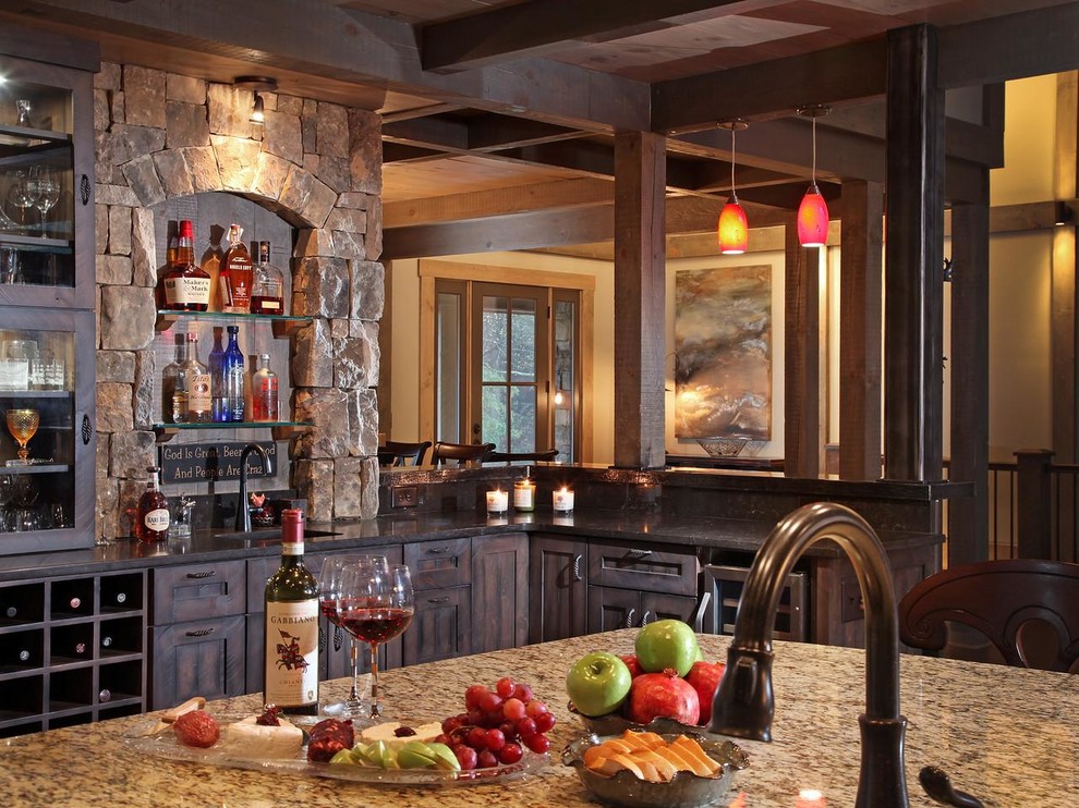 Mountain style kitchen photo in Atlanta with stainless steel appliances and an island