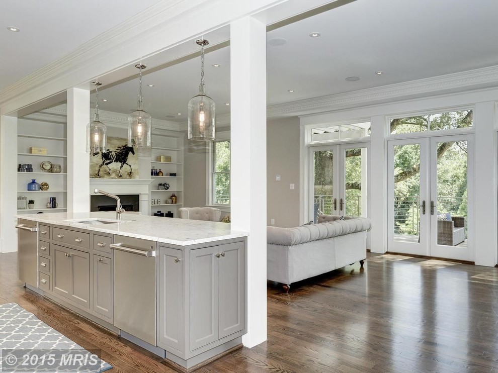 Eat-in kitchen - large transitional l-shaped medium tone wood floor eat-in kitchen idea in DC Metro with an undermount sink, shaker cabinets, gray cabinets, quartz countertops, white backsplash, stainless steel appliances, subway tile backsplash and an island