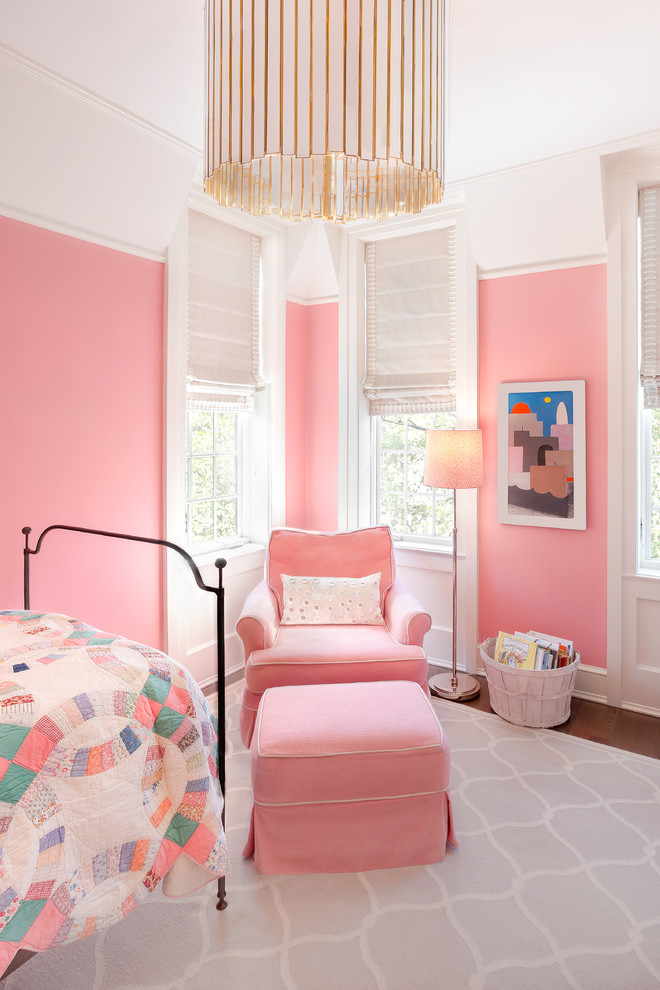 Inspiration for a transitional kids' bedroom for girls and kids 4-10 years old in Chicago with pink walls and dark hardwood floors.