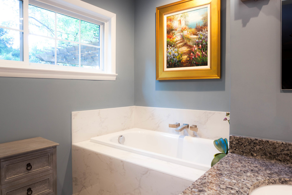 Inspiration for a large transitional master white tile and ceramic tile ceramic tile and beige floor drop-in bathtub remodel in Atlanta with shaker cabinets, white cabinets, a one-piece toilet, blue walls, an undermount sink and granite countertops