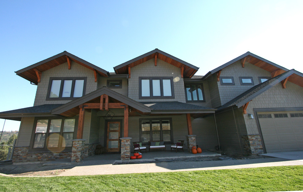 Large three-storey grey exterior in Seattle with concrete fiberboard siding and a gable roof.