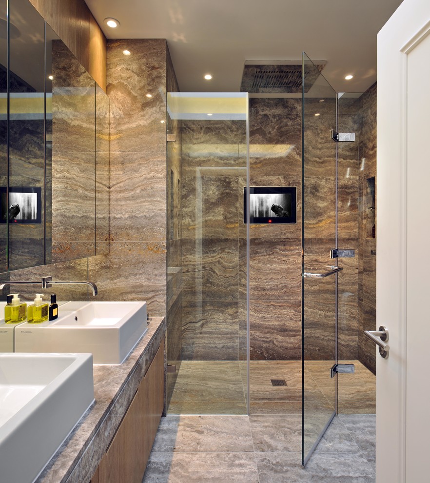 Design ideas for a contemporary master bathroom in London with a vessel sink, a curbless shower, travertine floors, flat-panel cabinets, medium wood cabinets, brown tile and travertine.