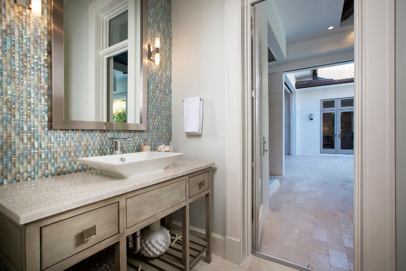 Master bathroom in Other with furniture-like cabinets, grey cabinets, a freestanding tub, a double shower, white tile, an undermount sink and multi-coloured floor.