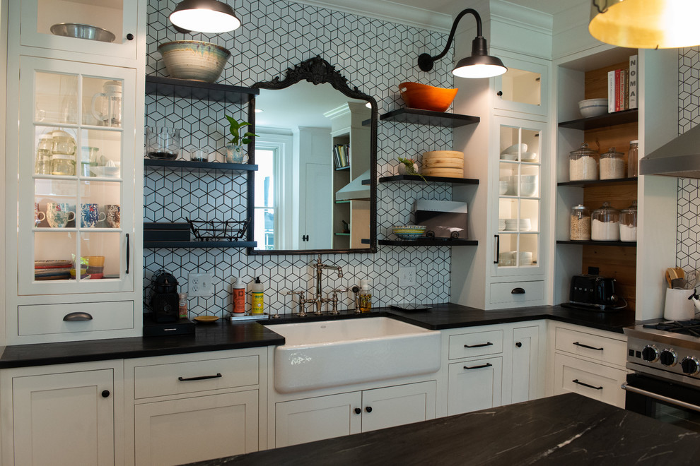 This is an example of an eclectic l-shaped kitchen in Philadelphia with soapstone benchtops and black benchtop.