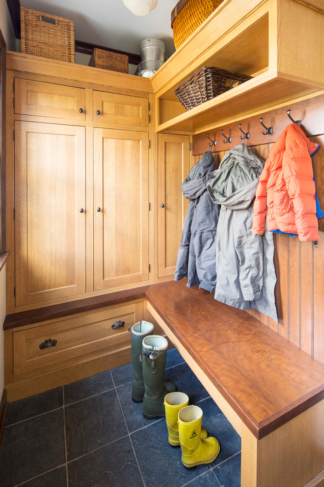 Entryway - mid-sized farmhouse ceramic tile entryway idea in Minneapolis with white walls