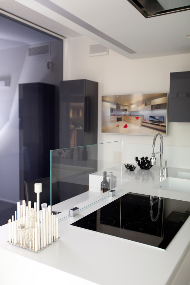 This is an example of a mid-sized contemporary open plan kitchen in Milan.