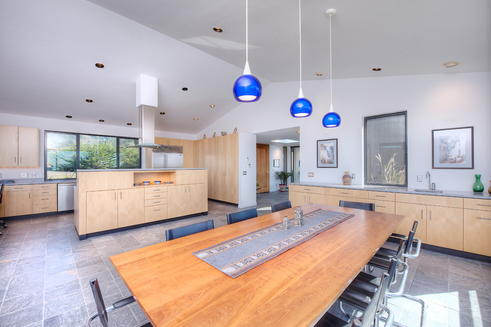 Inspiration for a large contemporary kitchen/dining combo in San Francisco with white walls and slate floors.